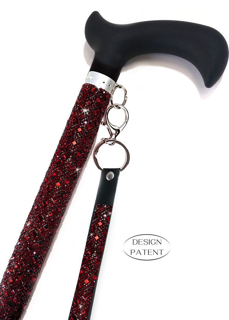 The Jacqueline Kent Sugar Cane is designed as a straight style adjustable medical grade adjustable cane with a comfortable sturdy resin handle. The adjustable shaft measures 7/8" diameter and adjusts 29" to 38" with locking nut for safety. Lower shaft measures 3/4" diameter including a rubber foot. Each cane supports up to 250 pounds. Each handcrafted Sugar Cane is embellished with approximately 5000 rhinestones and includes a black velvet tote bag.
