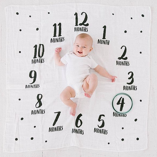 his Watch Me Grow Photo Blanket makes a great way to celebrate a little one's growth in style! Set includes a cotton muslin blanket and 3 photo-sharing props to track baby's growth during their first year. 