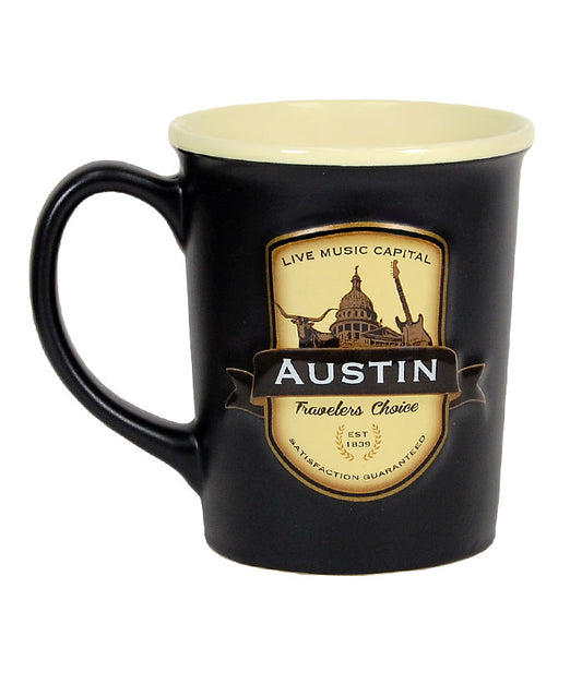 This generously sized two tone ceramic stein style mug, features a beautiful black matte exterior and contrasting tan interior inspired by the “black and tans” served in old time Irish pubs. The raised emblem features popular Austin Icons.