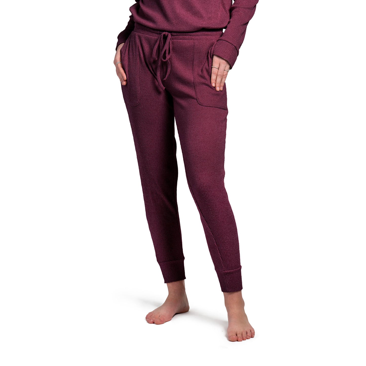 1600 × 1600px  Treat yourself to cuddle worthy softness! We curated these cozy rib knit pants for luxurious comfort with a buttery mid-weight fabric and cozy side pockets. Matching drawstring pouch packaging makes this item a great gift! Color wine.