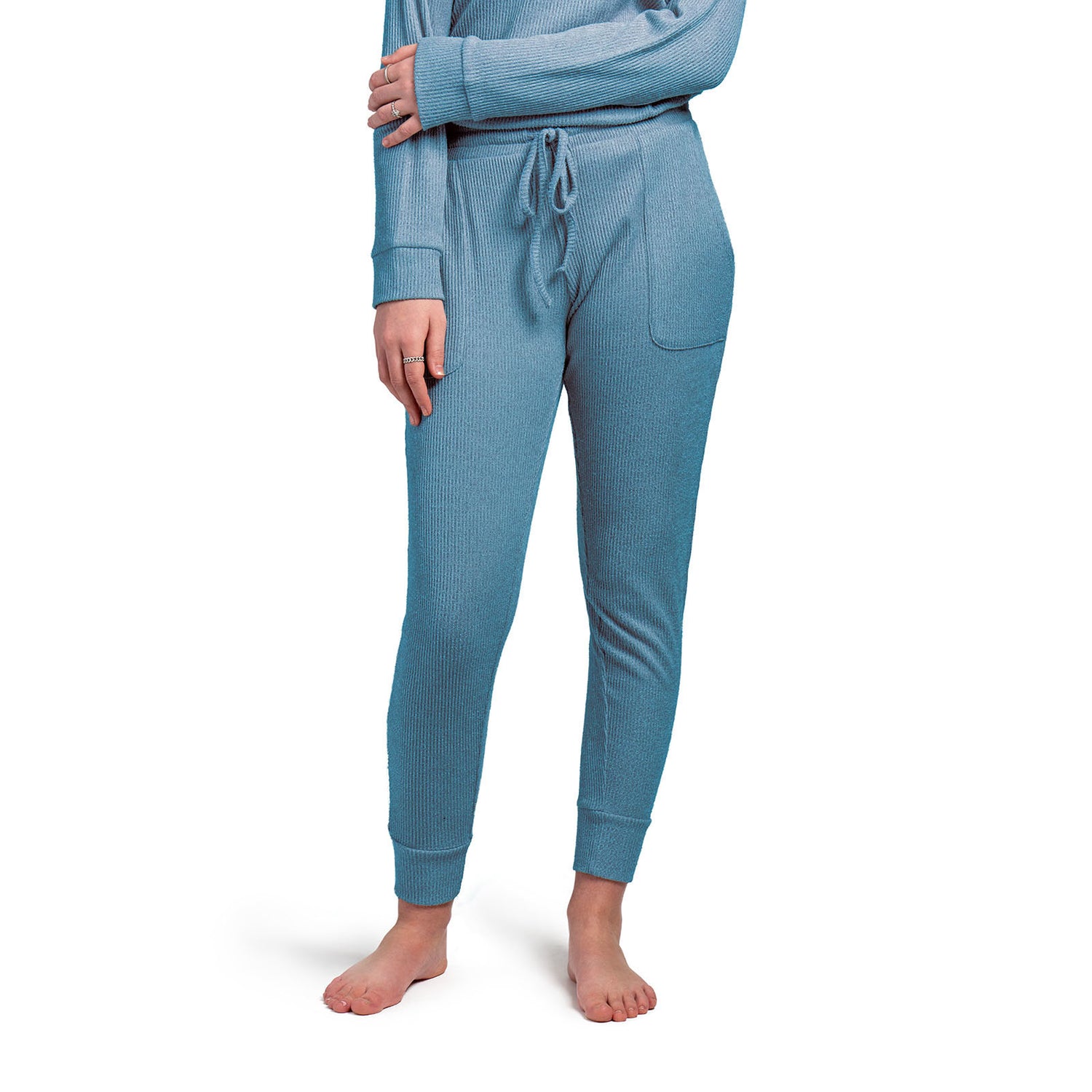 Treat yourself to cuddle worthy softness! We curated these cozy rib knit pants for luxurious comfort with a buttery mid-weight fabric and cozy side pockets. Matching drawstring pouch packaging makes this item a great gift! Color blue.
