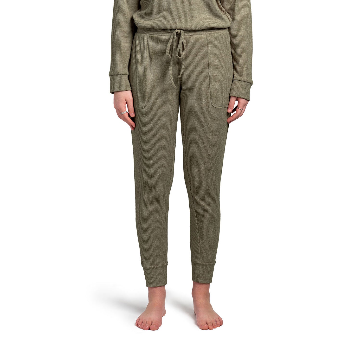 1600 × 1600px  Treat yourself to cuddle worthy softness! We curated these cozy rib knit pants for luxurious comfort with a buttery mid-weight fabric and cozy side pockets. Matching drawstring pouch packaging makes this item a great gift! Color soft green..