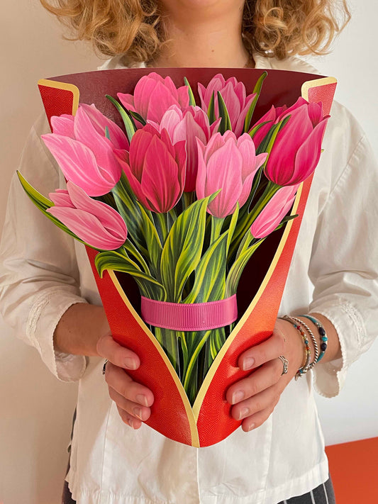 Show someone you care with a warm arrangement of FreshCut Paper pop up flowers. This is a greeting card and a vibrant bouquet. This lively display will bloom for a long time and can be used in the ICU. Pink Tulips Shown here.
