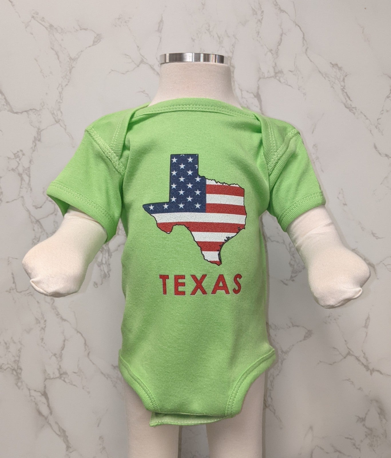 Onesie with USA Map Design in Texas Map Shape designed and printed in the USA.  Machine Wash - Cold Water.  Available in Newborn and 6 Month.  Choose from the following neon colors: Green, Pink, Blue or Yellow.