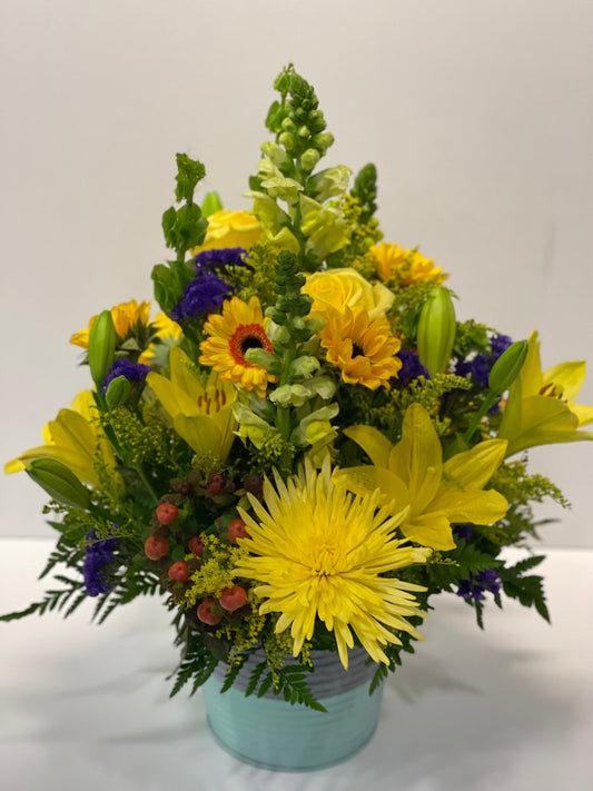 This colorful bouquet includes a combination of roses, asiatic lilies, alstroemeria, blue delphinium, pink snapdragons, blue eryngium, huckleberry, oregonia, Israeli ruscus, sword fern, silver dollar eucalyptus, and lemon leaf. Each arrangement is unique and different. Great for get well or new baby flowers delivered to loved ones in St. David’s Medical Center at 919 E. 32nd Street. Austin, Texas, with same day delivery if ordered before store closing. 18 - 20 inches 