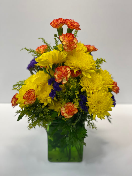 Send a mixed bouquet with bright carnations, lavender flowers, and colorful blooms adorned with ribbons in playful colors. Get well soon and new baby flowers delivered to loved ones in St. David’s Medical Center at 919 E. 32nd Street. Austin, Texas, with same day delivery available if ordered before store closing. 12"-14"
